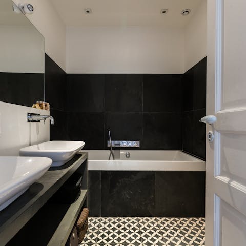 Relax with an evening bubble bath in the tub – a glass of fizz, optional