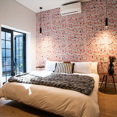 Cosy up in the stylish bedrooms with snazzy wallpapers and local artwork