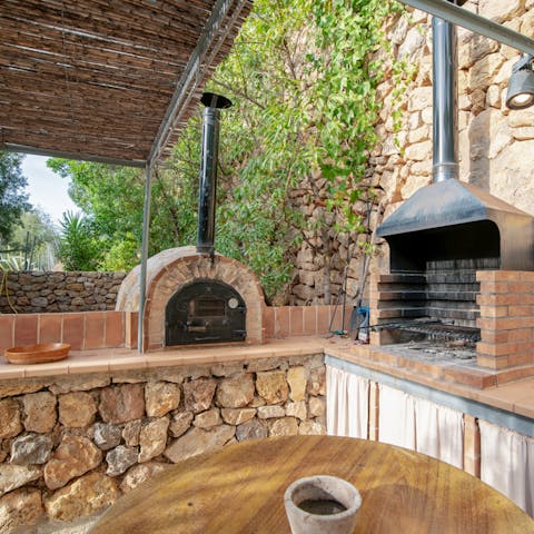 Get the built-in brick barbecue going for a feast outside