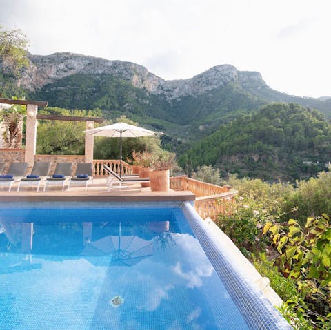Gaze out at the mountain scenery from the edge of the infinity pool