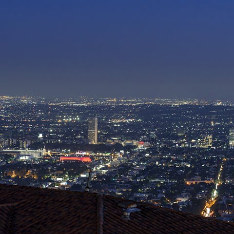 Admire the city lights at night from the roof