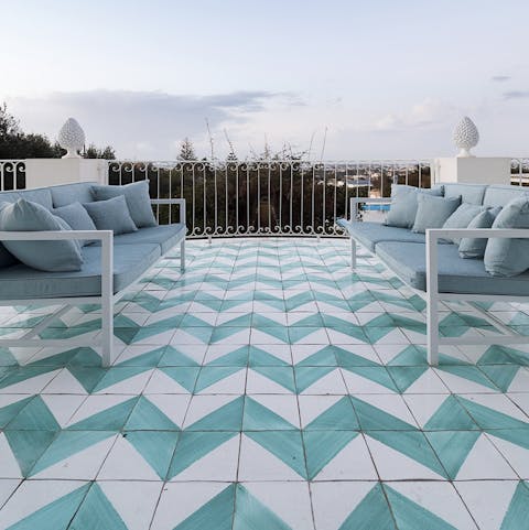 Watch the sky turn pink at dusk from the stylish rooftop terrace