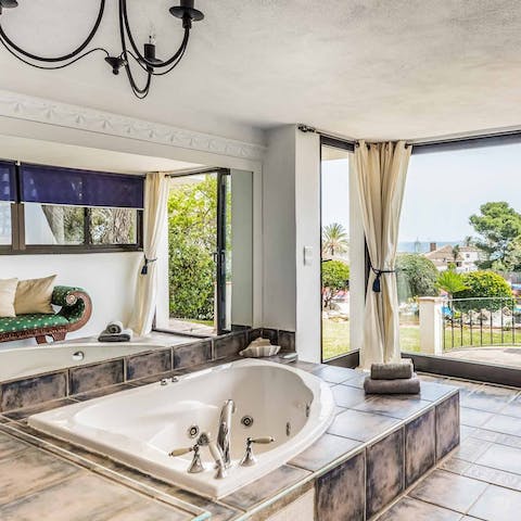 Enjoy a soak with a glass of Spanish wine