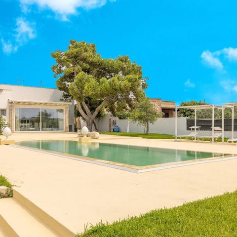 Enjoy leisurely days soaking up the sun by the pool