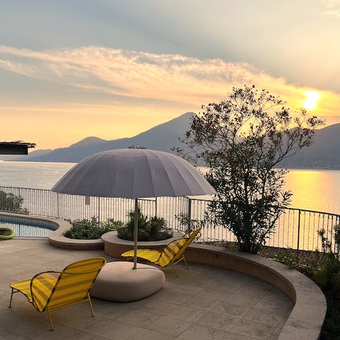 Watch the sun setting behind the mountains from the poolside