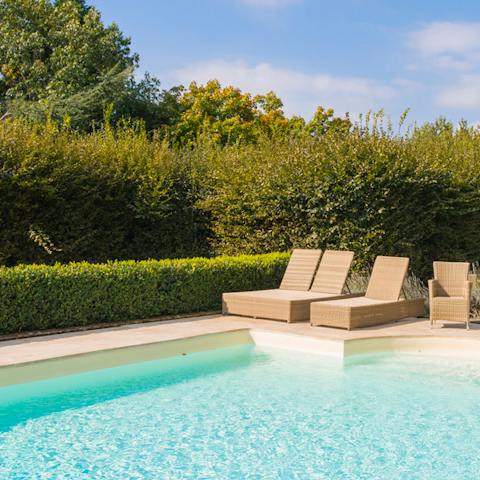 Bask under the Perigourdine sunshine next to the pool