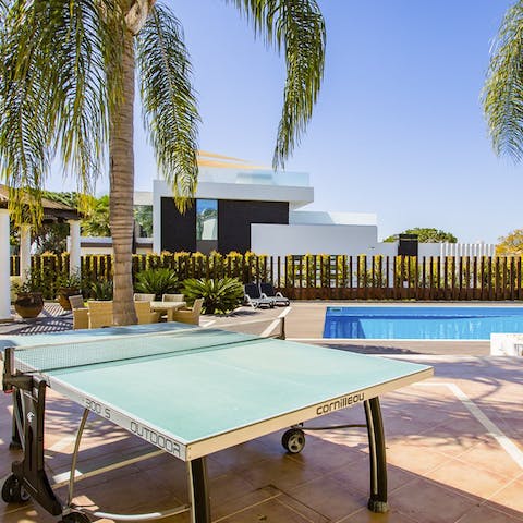 Play some poolside table tennis