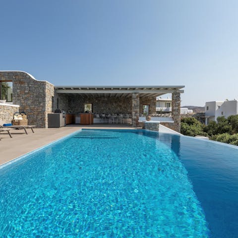 Enjoy regular dips in the infinity pool on long, hot afternoons