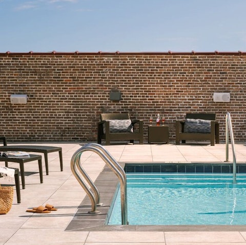 Hang out at the communal rooftop pool and sun lounger area to soak up some Louisiana sunshine
