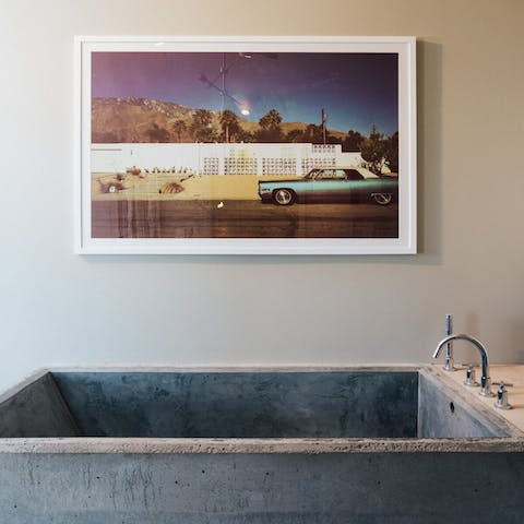 Unwind with a soak in the cement bathtub