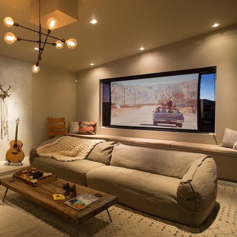 Watch your favourite film on the projector in the living room