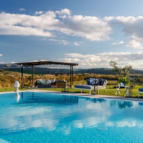 Soak up the views of the home's private lake from the palatial private pool