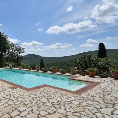 Swim in the pool and admire far-reaching views of the lush valley