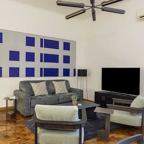 Relax in the living room with a glass of Italian wine after a day of exploring the city