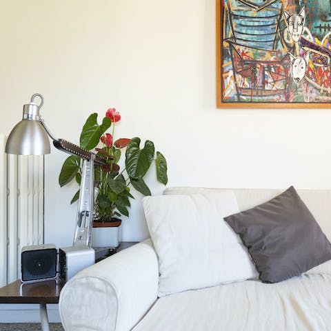 Sip a robust espresso and plan your itinerary on the soft designer sofa