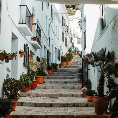 Explore Frigiliana's cobblestone streets