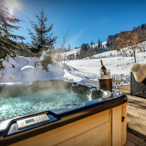 Admire the snowy outlook in the Jacuzzi with a glass of Champagne