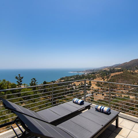 Sunbathe as you enjoy the ocean views from the balcony
