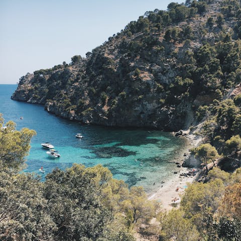 Swim the crystal clear waters off Calla Blanca, a short walk away
