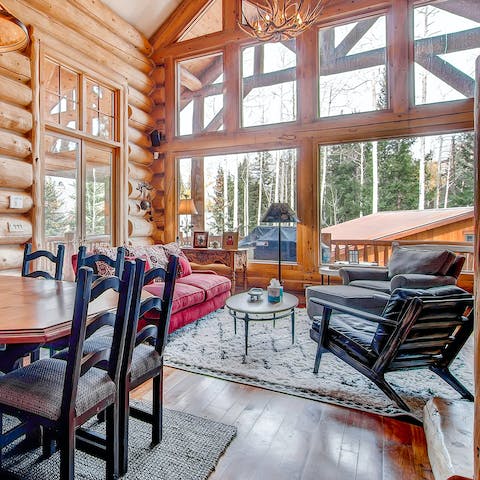 Take in the mountain scenery through floor-to-ceiling windows