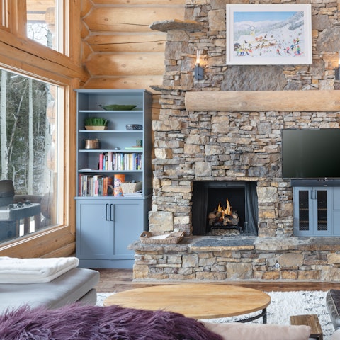 Curl up with a book beside the large stone hearth
