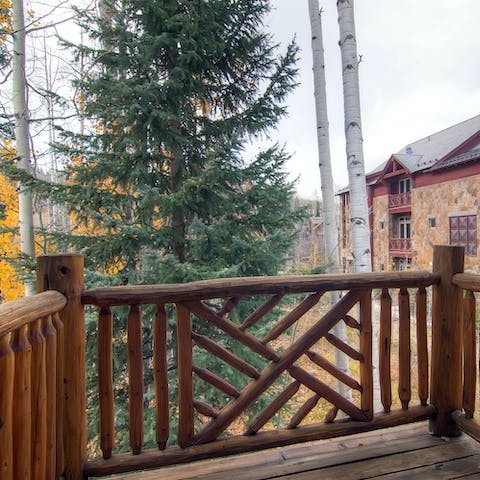 Breathe in the scent of pines from the balcony as you enjoy a BBQ
