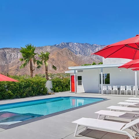 Admire picturesque mountain views from the sun loungers