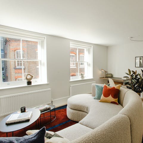 Make yourself comfortable on the boucle couch with a hot mug of tea