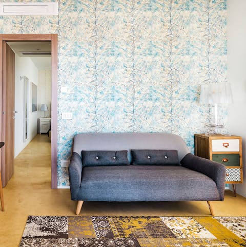 Unwind with your favourite book in the eclectic living room