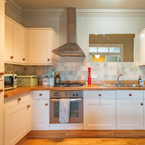 Rustle up a home-cooked meal in the farmhouse-style kitchen for cosy nights in