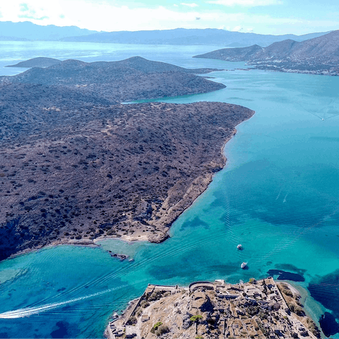 Sink your toes into the sands of Agios Nikolaos Beach, a short walk away