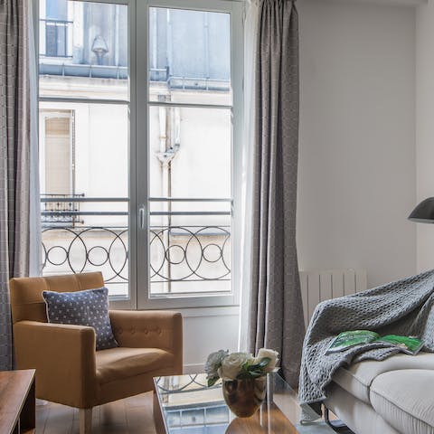 Sip a glass of wine at the window seat as you peer over the balcony