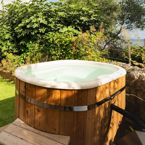 Enjoy an indulgent soak in the private hot tub