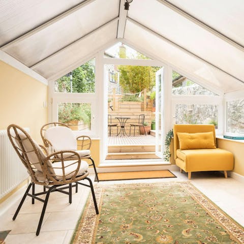 Relax in the conservatory overlooking the garden