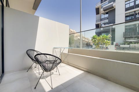 Enjoy the fresh air and city views out on the balcony with your morning coffee