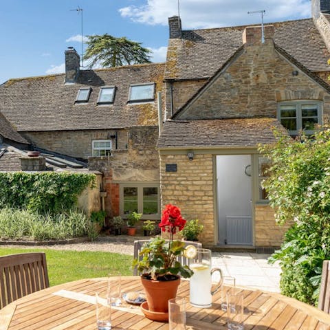 Enjoy an alfresco tipple in the sun-kissed garden