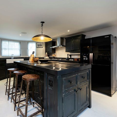 Cook together in the chic black kitchen