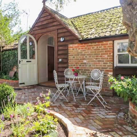 Savour drinks in the peaceful cottage garden