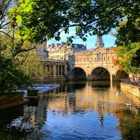 Marvel at Pulteney Bridge's Georgian architecture in nearby Bath