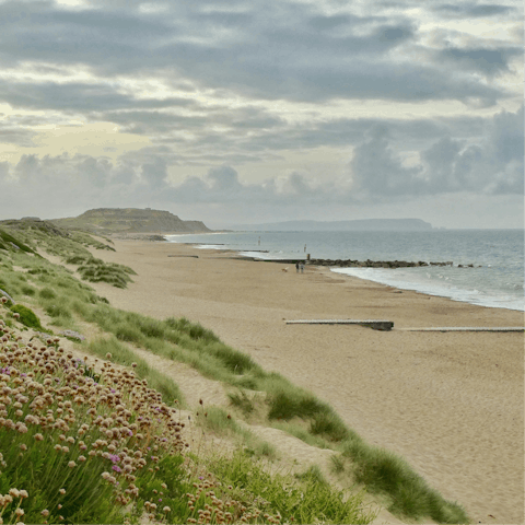 Walk along the beautiful sandy beaches of the Dorset coast, mere minutes away