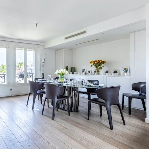 Gather around the dining table for a glamourous evening meal in