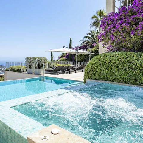 Step into the outdoor Jacuzzi for a scenic soak