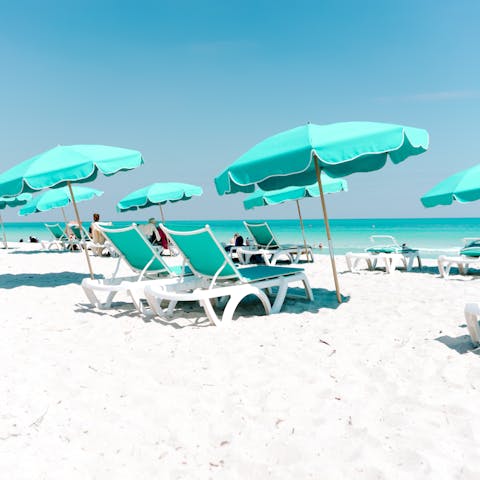 Spend your days sprawled out on the iconic shores of Miami Beach, just a three-minute walk from home