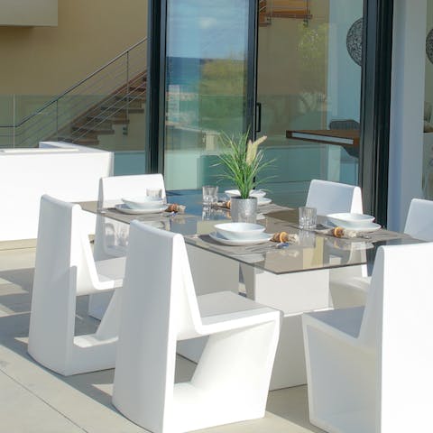 Gather for heart-warming evenings around the outdoor dining table
