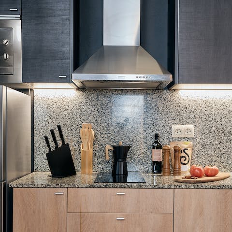 Prepare your morning coffee in the sleek, open-plan kitchen