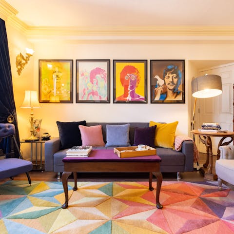 Kick back in the colourful living room with a glass of wine after a day of exploring the city on foot