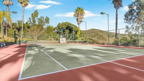 Serve and volley against a backdrop of rolling hills