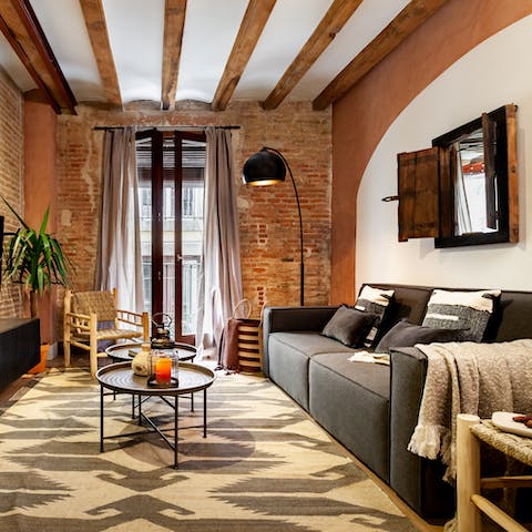 Chill out in the stylish living with a glass of Spanish wine while a record plays