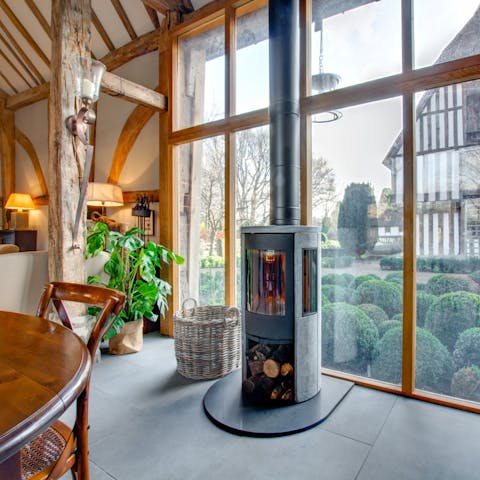 Take turns stoking the fire as you cook dinner