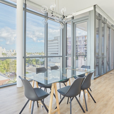Share a meal or work from home at the glass-topped dining table
